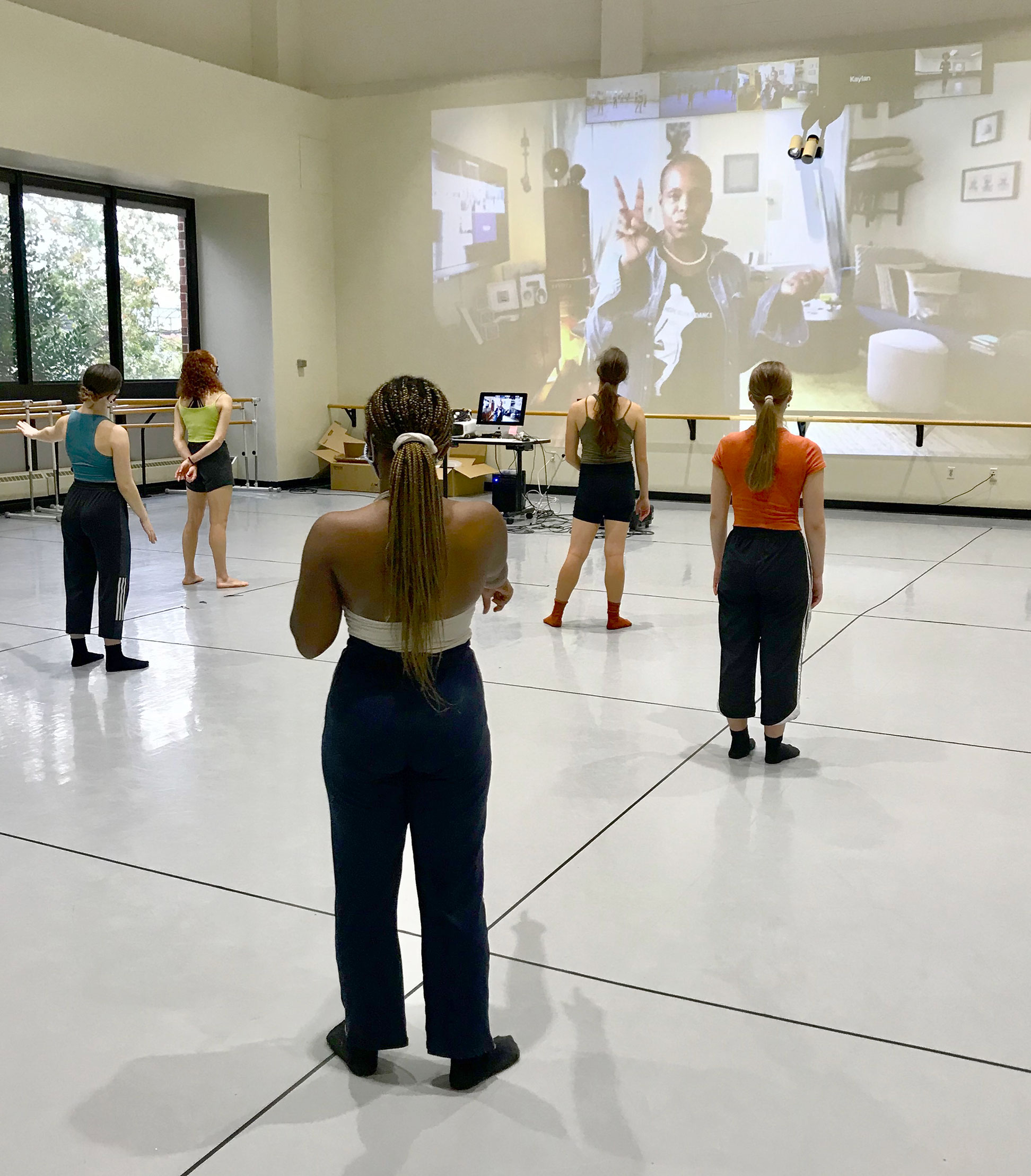 Hope Boykin teaching Mason Dancers through Window Wall
