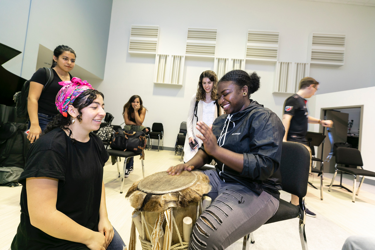 LADAMA holding a drumming workshop for percussion students at Manassas Park High School and Mason students enrolled in World Music Classes.