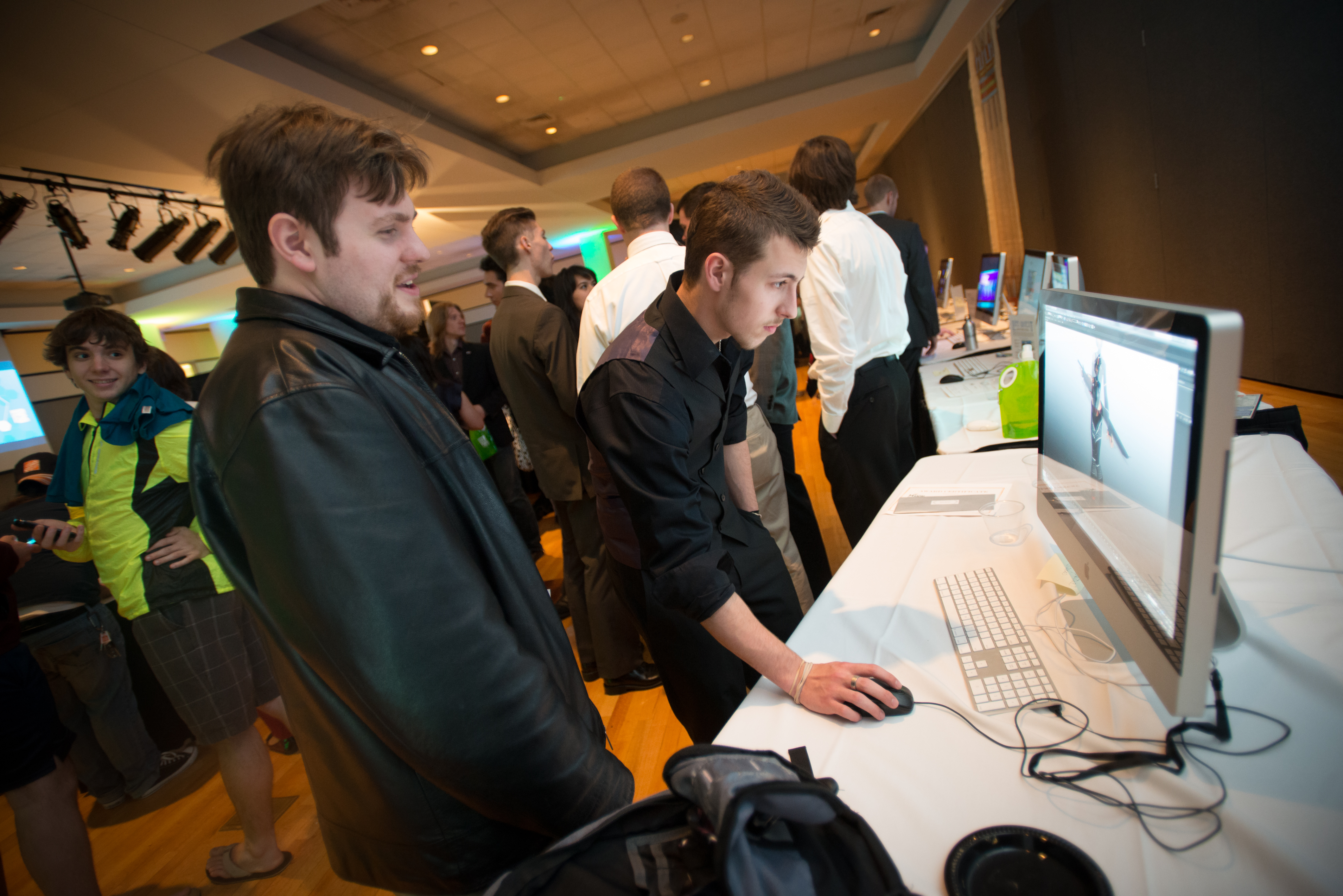 Game Design students presenting their work at the Senior Game Design Expo. Photo by Evan Cantwell/George Mason University