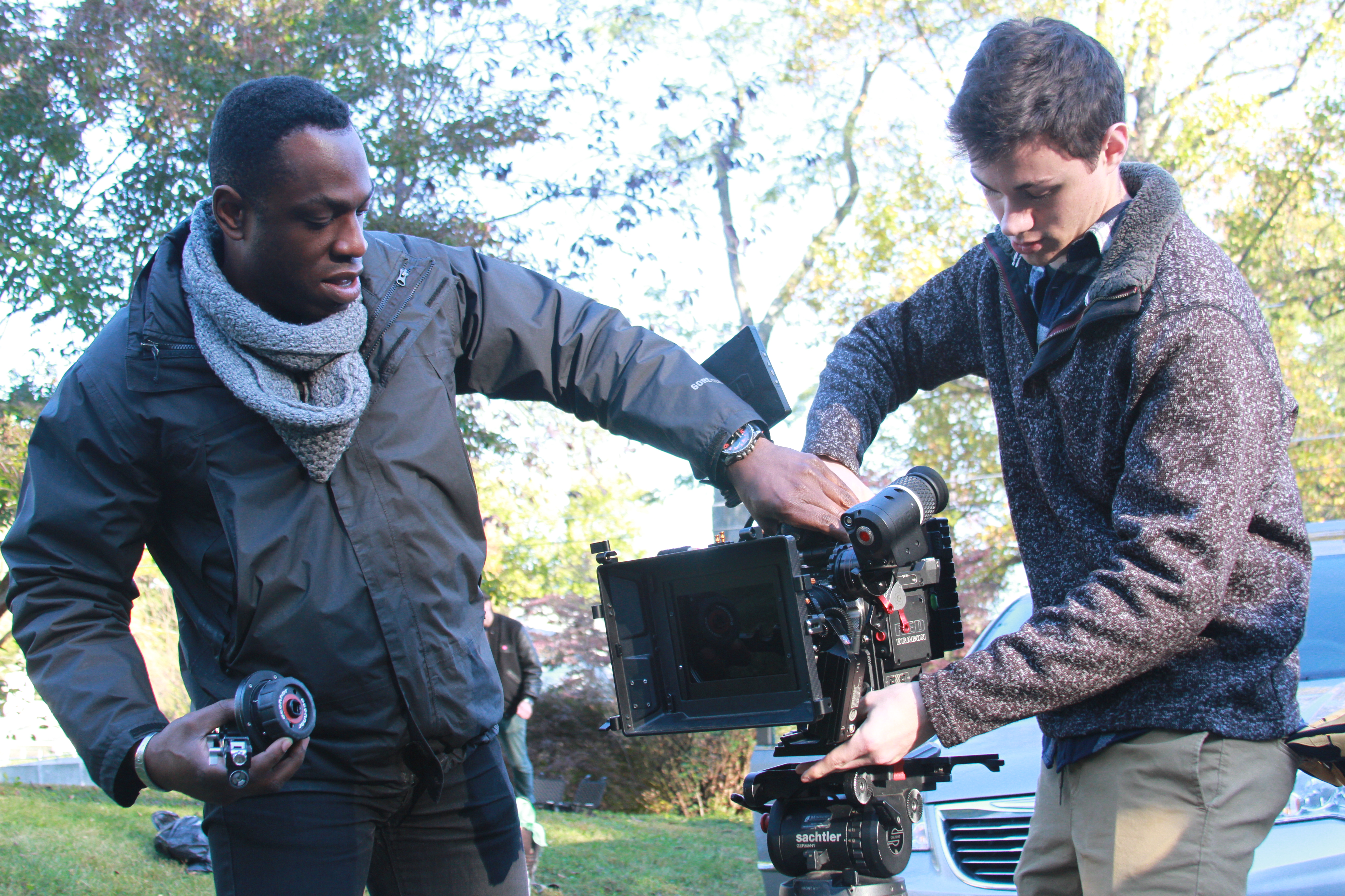 Film and Video Studies student working on set with Emmy-nominated faculty member and cinematographer, Hans Charles.