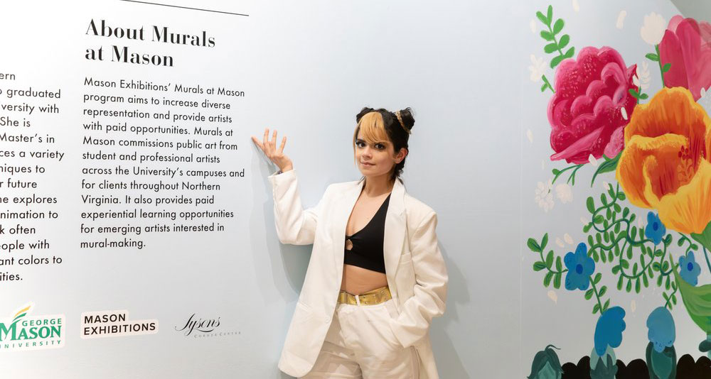 In the Fall of 2023, Mason Master of Art Teaching student, Emely Ramos, painted a 209 ft long x 7 ft tall mural featuring a series of iconic women throughout different periods of fashion for Tysons Corner Center, called Icons of Fashion. These notable figures are displayed in a runway format to showcase their memorable outfits. Tysons is the most "high-profile" client Murals at Mason has worked with so far, and the commission was only Emely's second (and the largest) mural she has done so far.