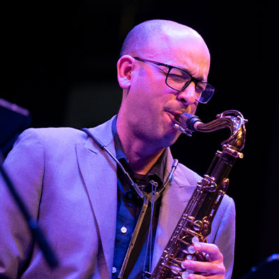 Prof. Xavier Perez playing the saxophone with passion