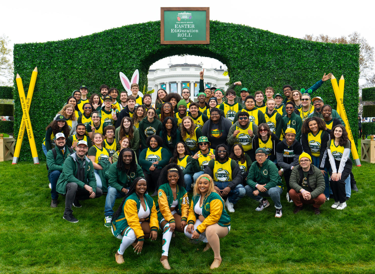 Students, faculty, and staff of the Green Machine Ensembles pose together in front of The White House at the annual Easter Egg Roll on April 1, 2024. Photo by Joshua Cruse & Nathaniel Henry / Green Machine Ensembles