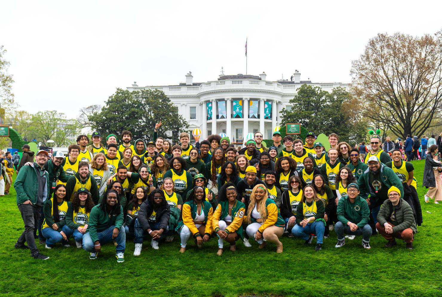 Students, faculty, and staff of the Green Machine Ensembles pose for a photo in front of the White House. Photo by Joshua Cruse & Nathaniel Henry / Green Machine Ensembles