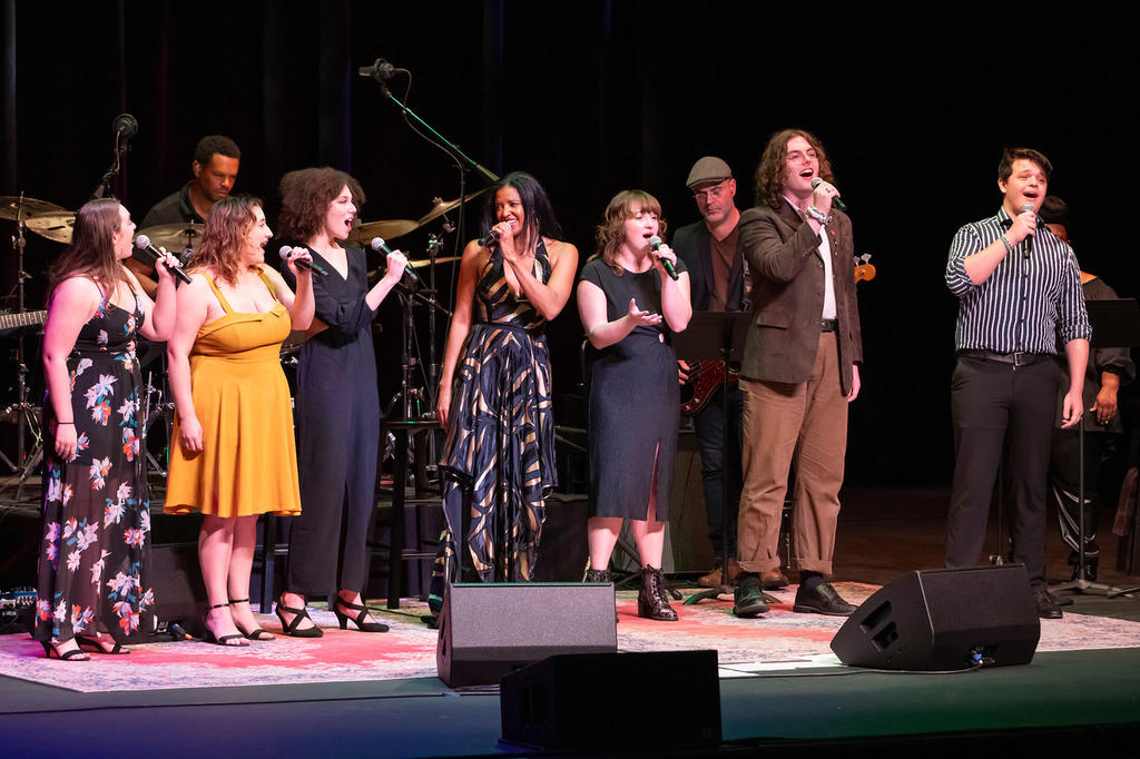 Renée Elise Goldsberry (center) is joined onstage during her concert by Mason School of Theater students (L-R) Sarah Stewart, Kamy Satterfield, Emma Harris, Lexi Carter, Brett Womack, and Aiden Breneman-Pennas.