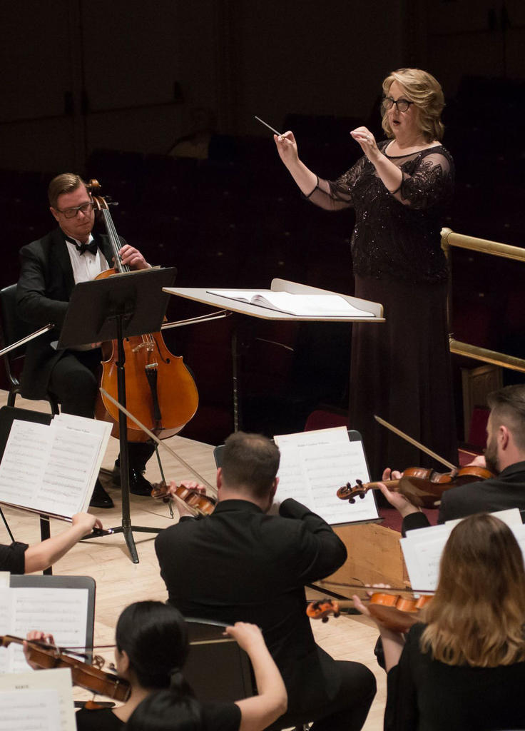 Dr. Lisa Billingham leads the George Mason University Chorale with the New England Symphonic Ensemble at Carnegie Hall.