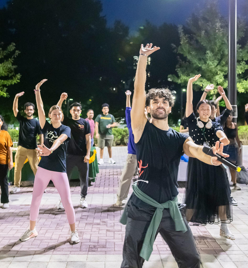Ballet Hispanico performing outside with patrons at mason