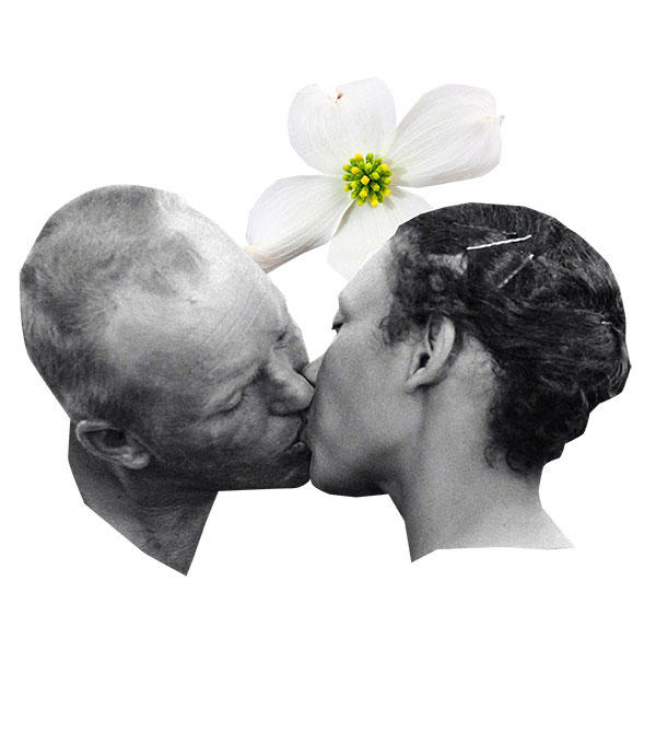 white man and black woman kissing in black and white
