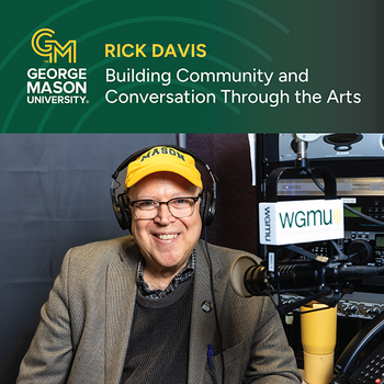 Rick Davis sitting in the WGMU studio. Rick is smiling and wears a bright yellow Mason baseball cap.